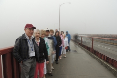Group Standing On Golden Gate Bridge