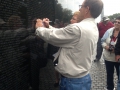 Tracing a name of a family friend at the Vietnam Memorial